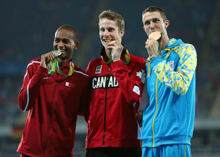Derek Drouin (CAN) wins gold, Mutaz Essa Barshim (QAT) wins silver, and Bohdan Bondarenko (UKR) wins bronze in the men s high jump during the track and field competition in the Rio 2016 Summer Olympic Games at Estadio Olimpico Joao Havelange.